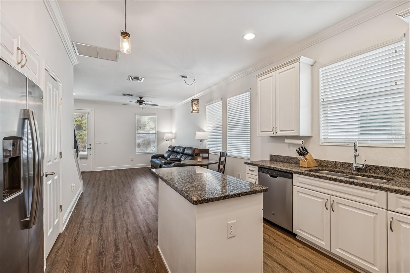 Open flow from kitchen into living space ensures ease of movement, perfect for entertaining or staying connected.