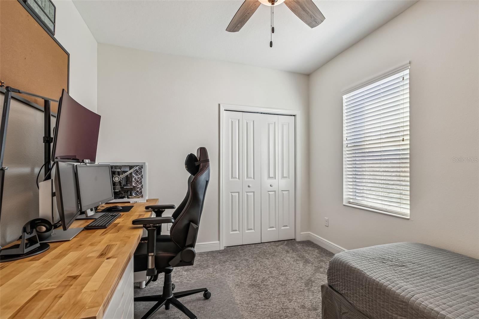 View from bedside shows the full layout, highlighting flexible use as a study, guest, or gaming room.