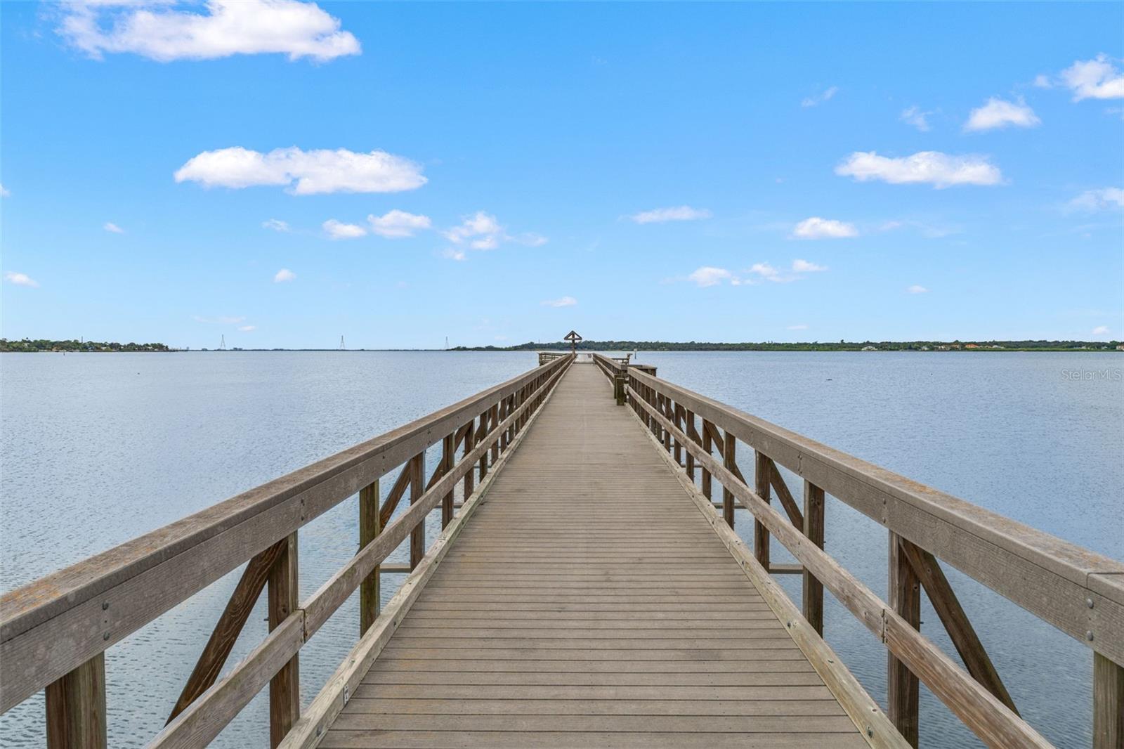 Expansive fishing pier reaching out into the bay, offering unobstructed views and a peaceful place to unwind.