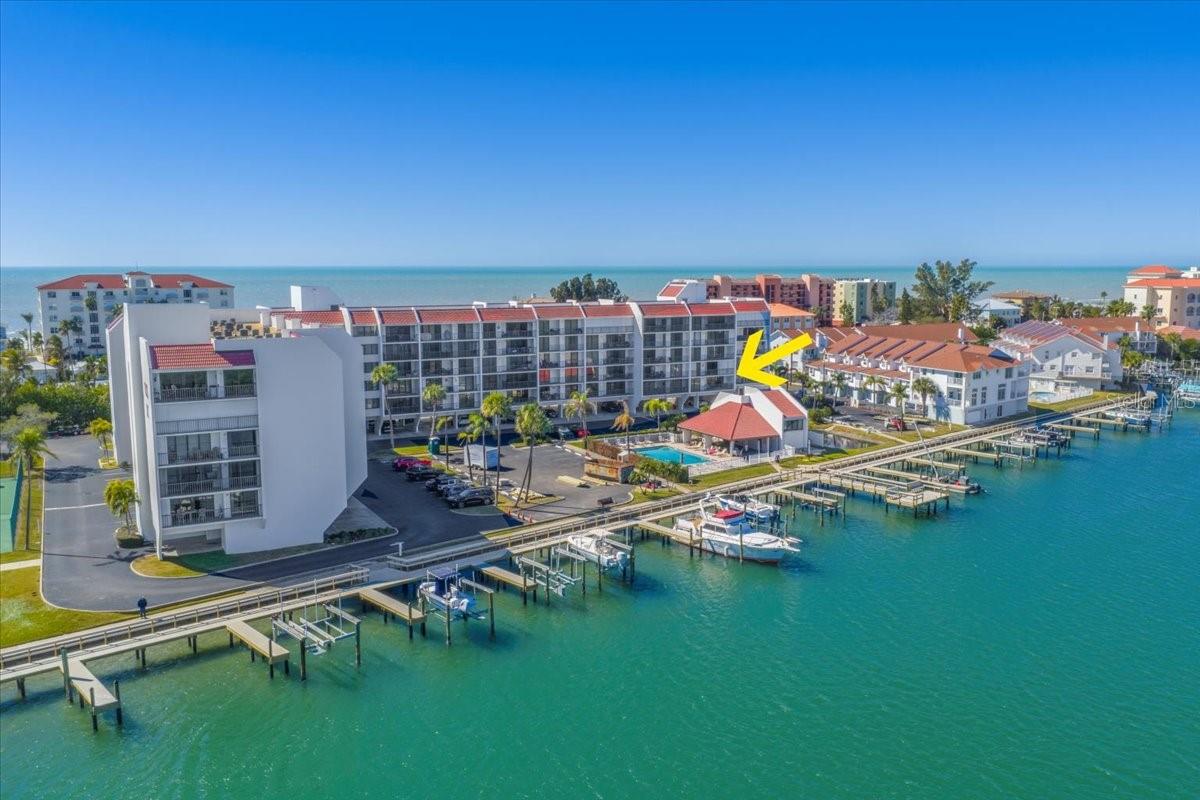 Amenities include lighted Tennis Courts, Pickleball, Shuffleboard, Waterside Grilling area, Fishing Pier, Dock, Resident Car Wash, and Heated Swimming Pool.