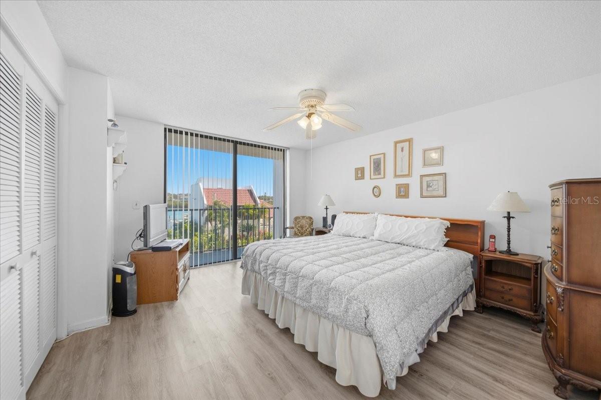 Spacious master with waterproof luxury vinyl flooring and wonderful water views from the bed, wake up to picturesque scenes every morning!