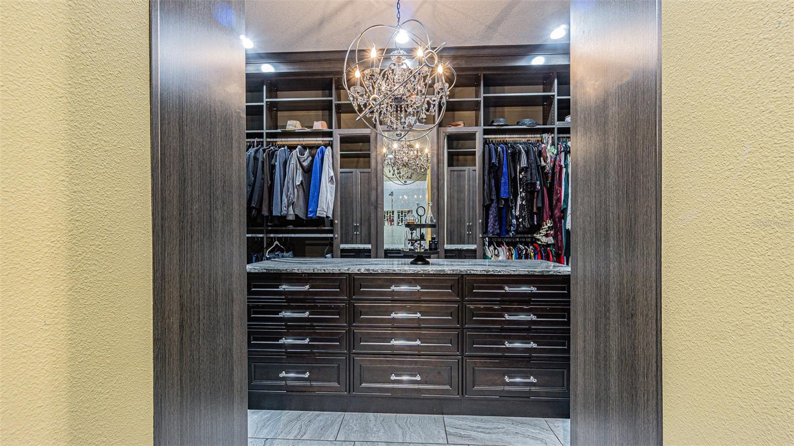 Primary bedroom walk in closet