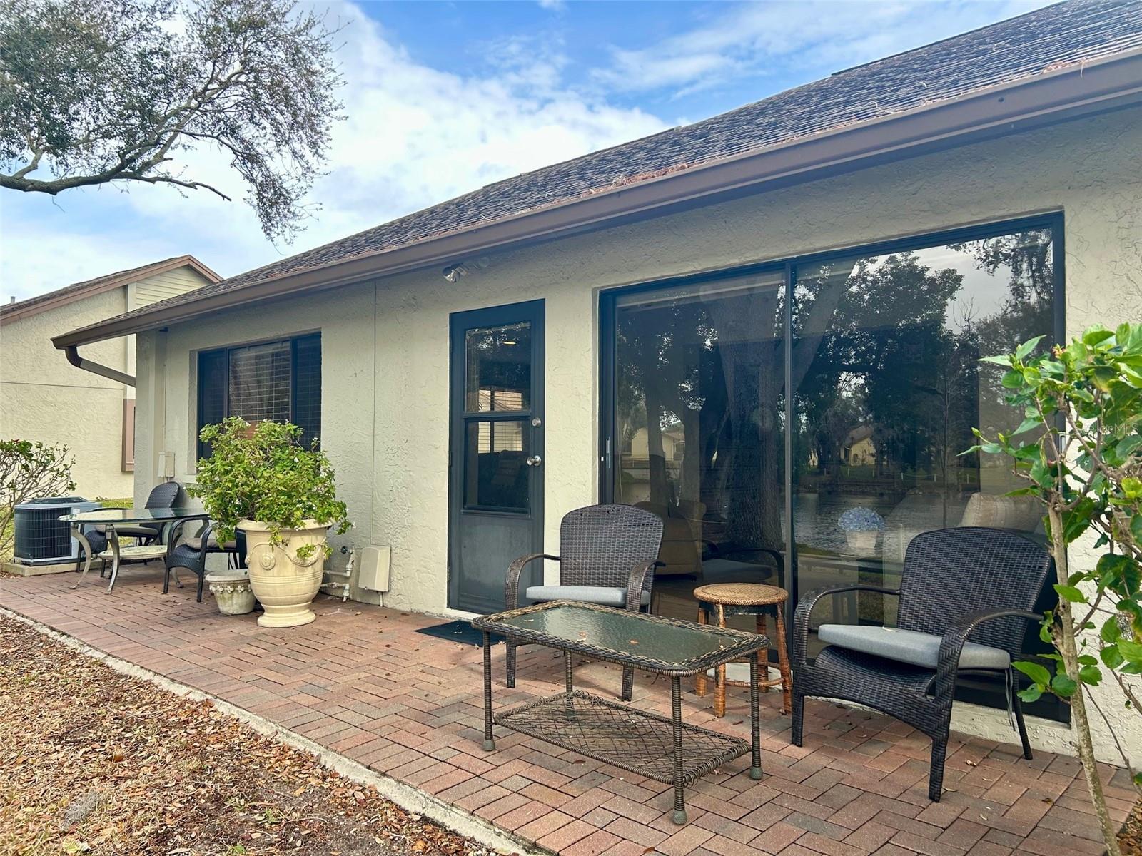 Paved Patio Looking Out The The Tranquil Lake