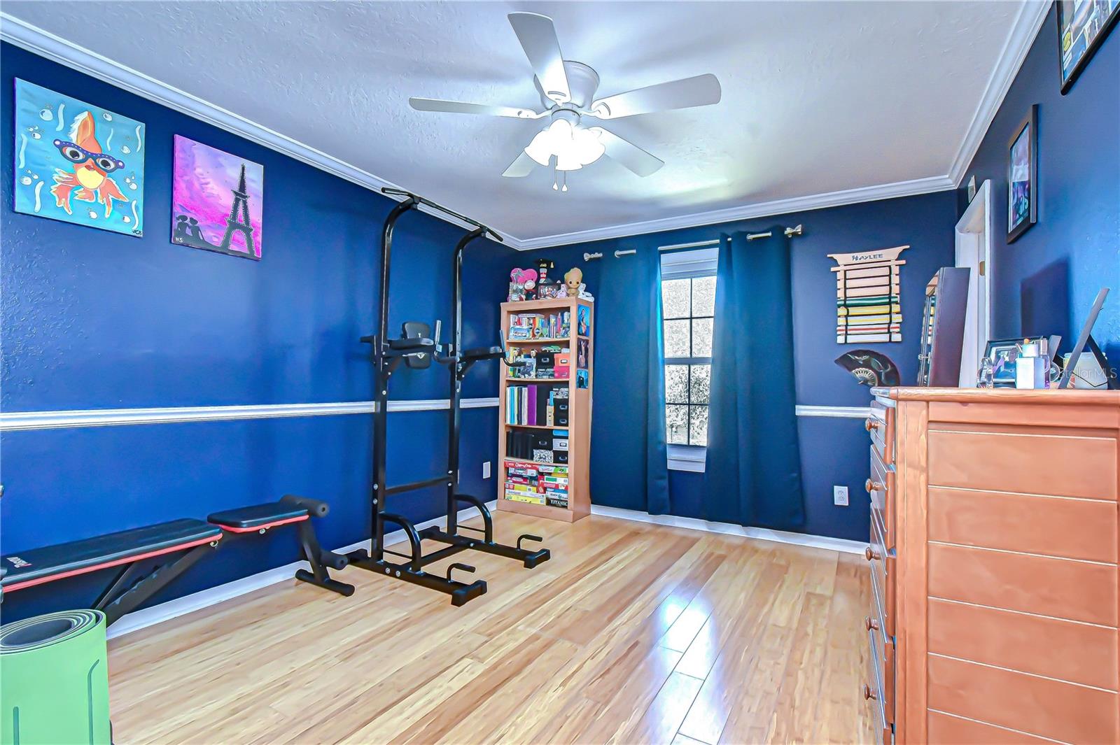 Bedroom with crown molding, and a large window for abundant natural light!