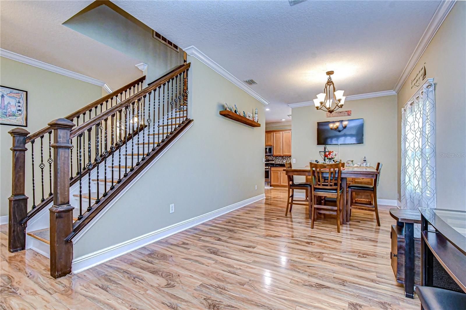 Open living and dining area with crown molding!