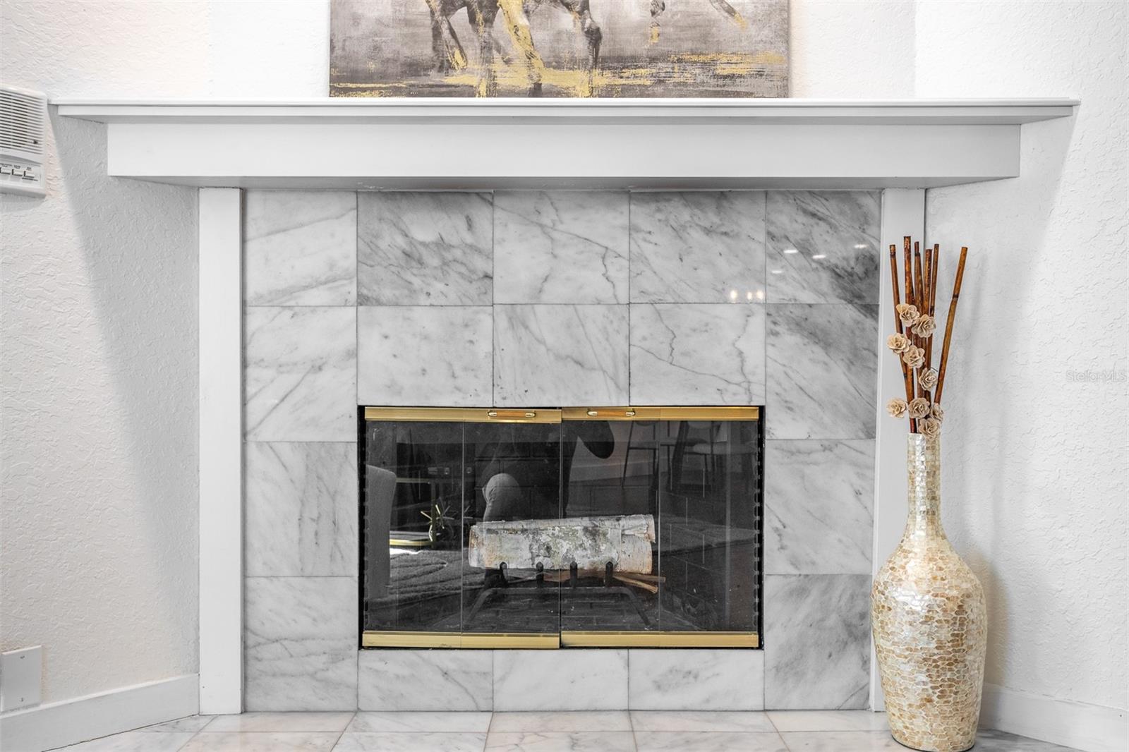 Wood burning fireplace in Family Room.