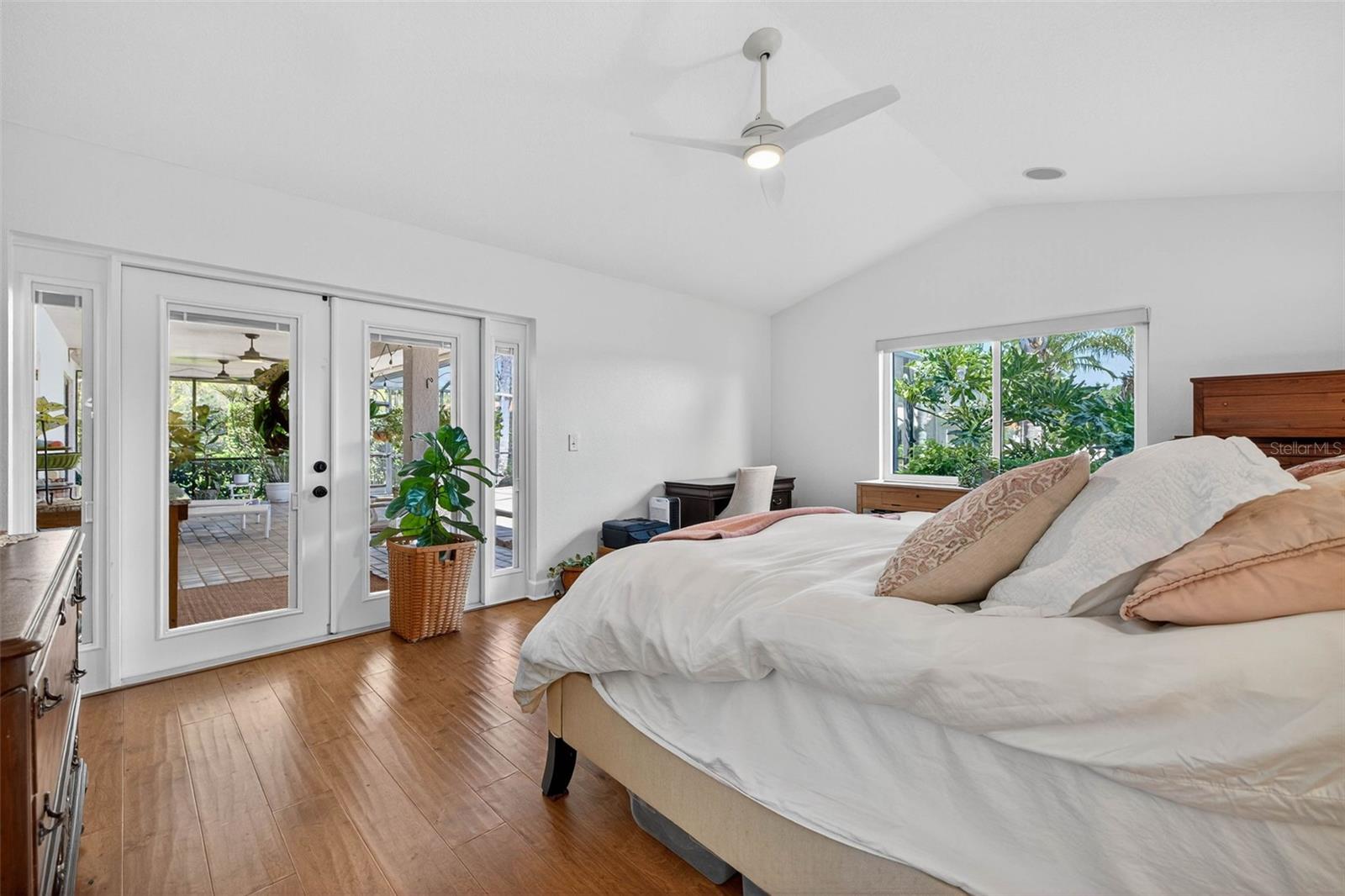 Spacious primary suite with french door access to the pool