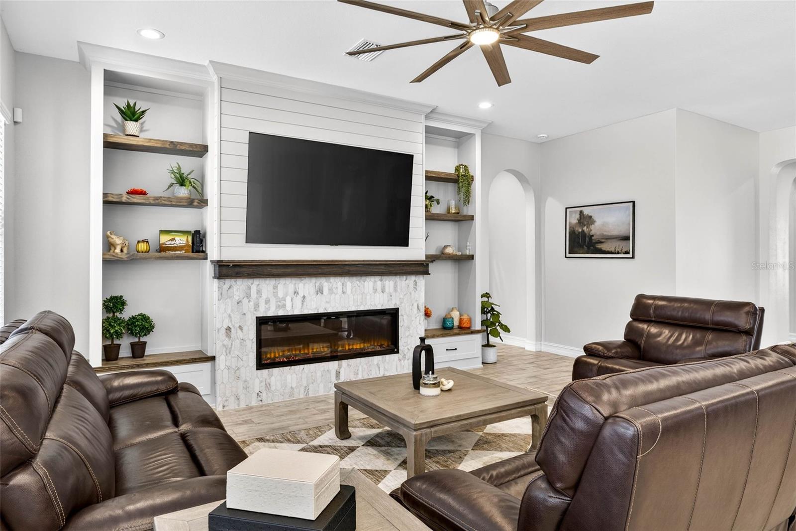 Overhead fan and bright windows leave natural light abundant all day.