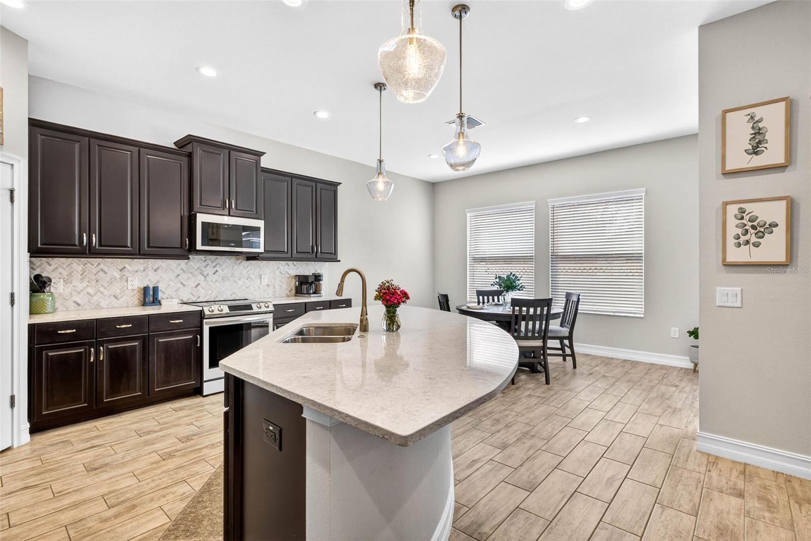 Sit at the island or open up this space.