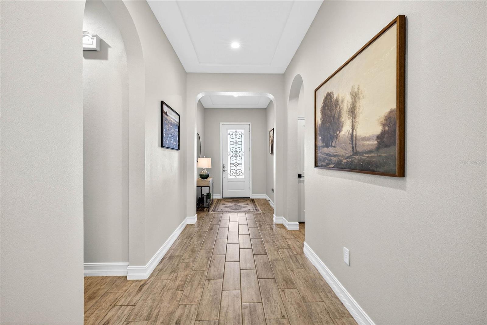 Bright & inviting your entryway with double tray ceiling and extended hallway gives this a 3 way split floorplan.
