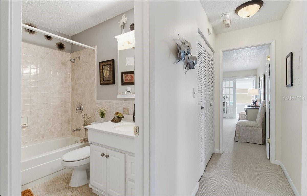 Guest bathroom , hallway closets , entrance to Master Bedroom