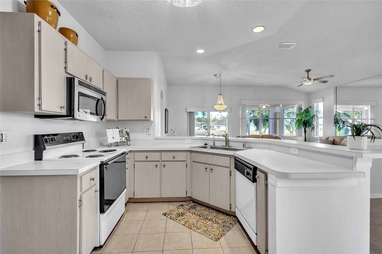 U shaped cabinet configuration area offers comfortable prep space.