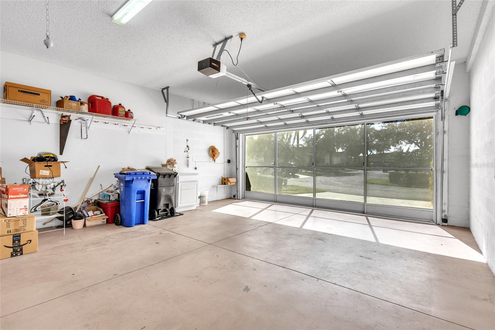 Small items in garage to be removed, but I wanted to share the view from the screened garage door.