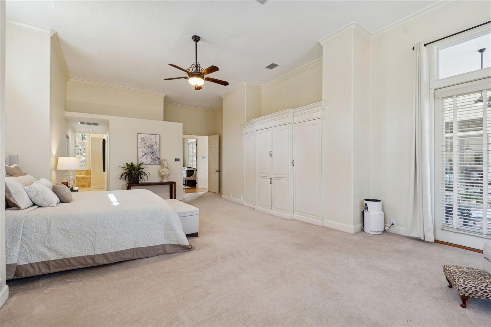 There Are Double French Doors Leading To The Lanai In Master And Built-In Cabinets