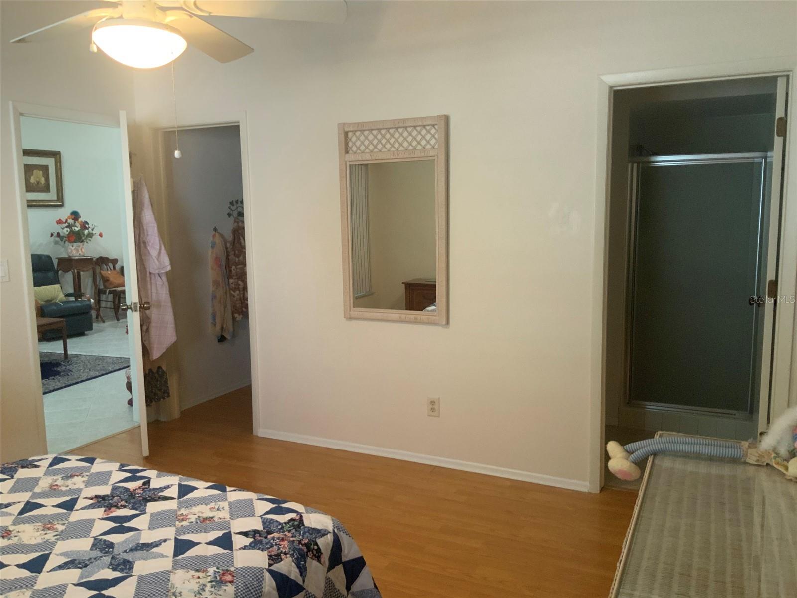 Primary bedroom with en-suite bath and walk-in closet