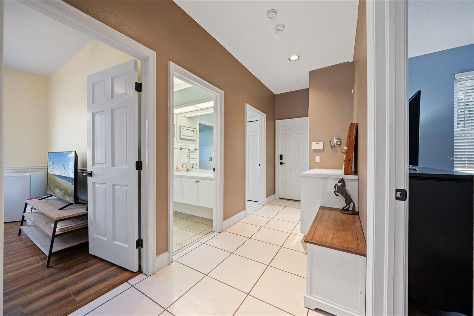 Bedroom 2 and 3 and full bath, laundry at end of hall.  Door out to Garage