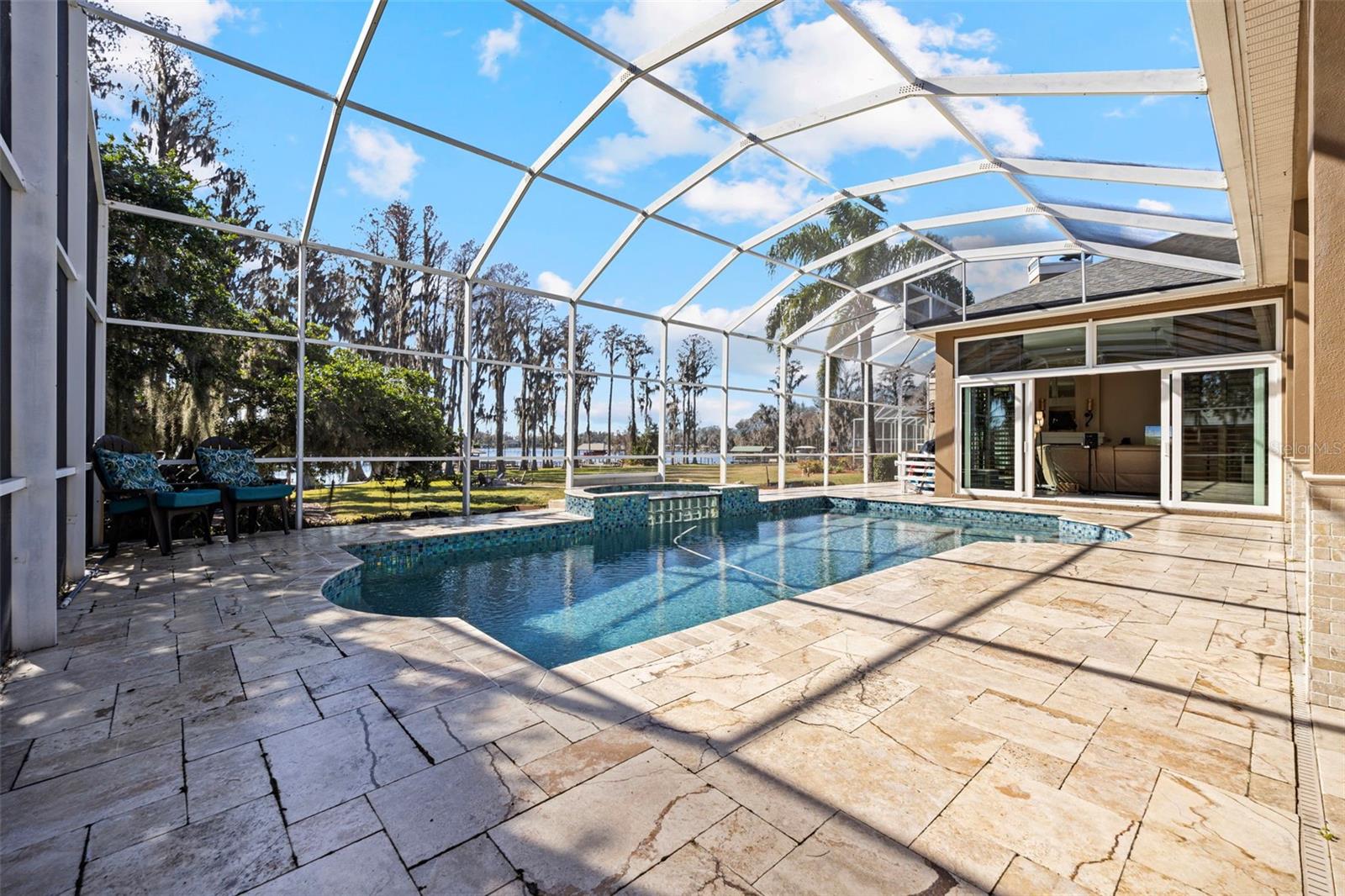 Back of home opens out to lanai and lake