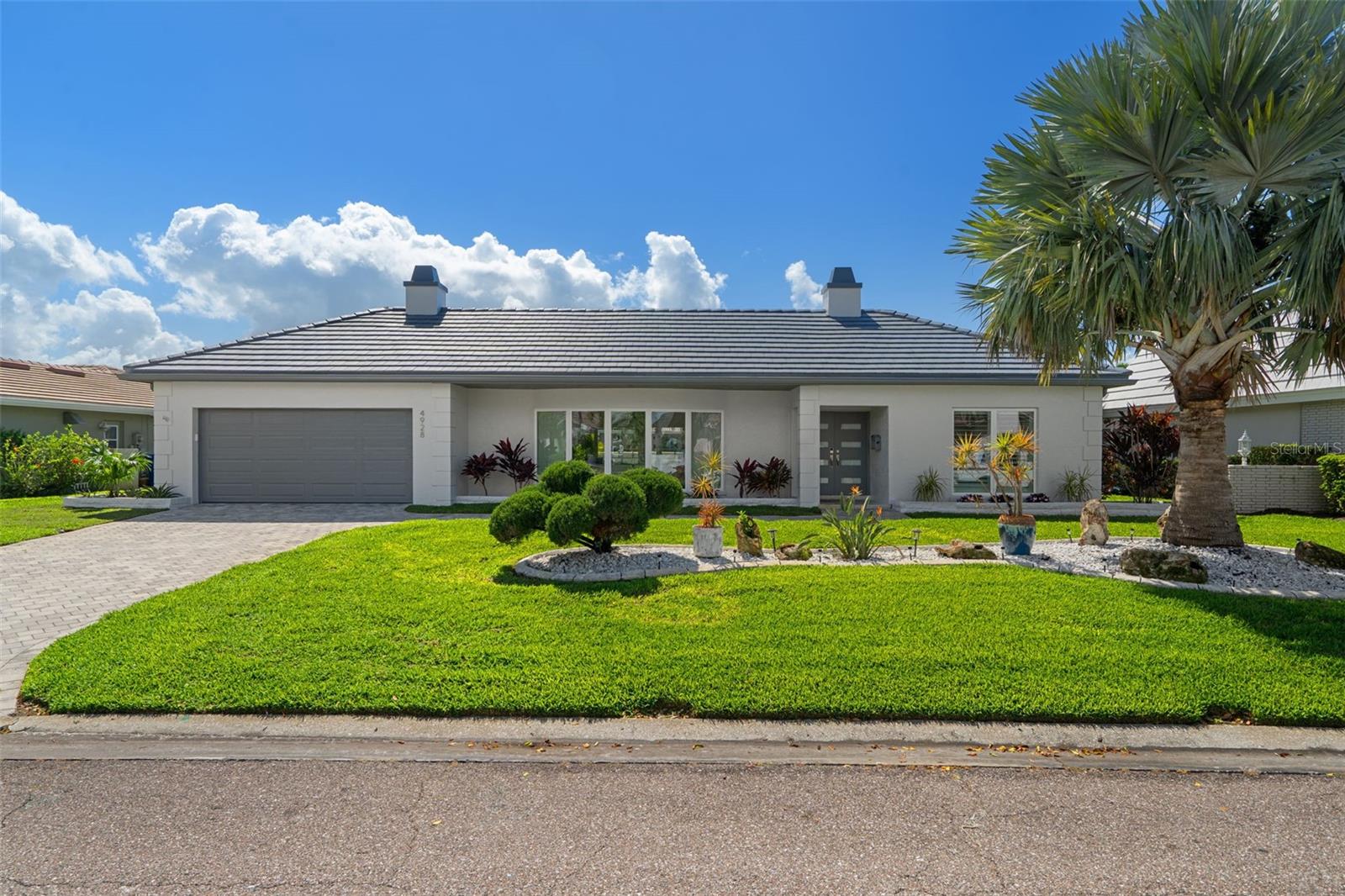 Waterfront living in the desirable gated Bayway Isles.