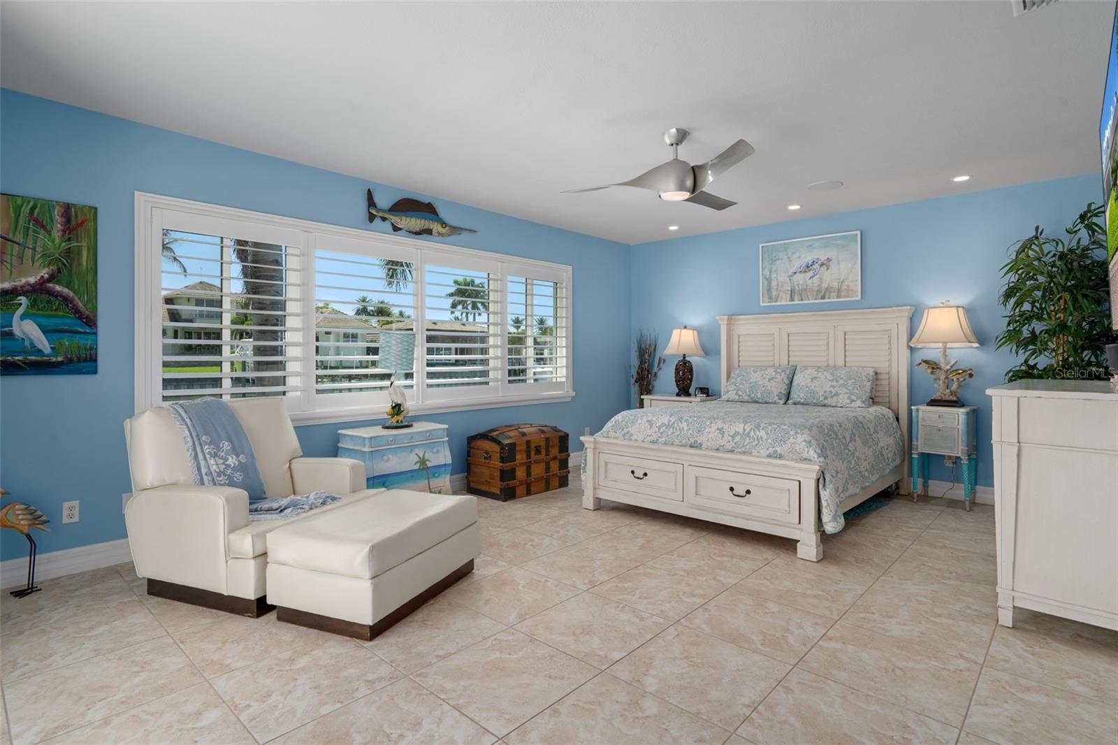 Primary bedroom Waterfront suite with pool access.