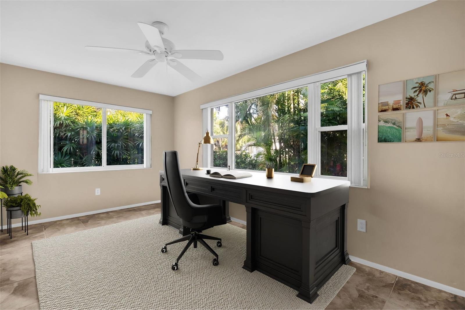 Florida room privately tucked within lush landscaping~