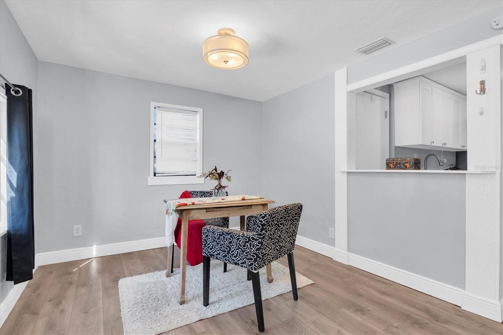 The front room is perfect for an office or dining room.