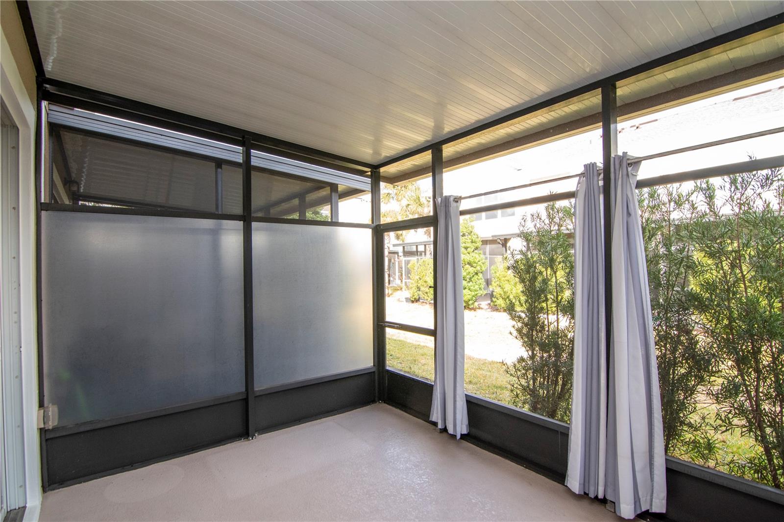 Screened Lanai with Curtains for Privacy