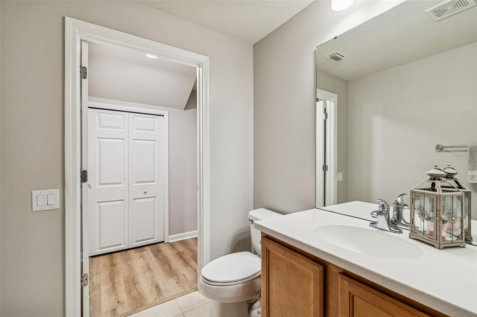 The bath opens into the main hall with easy access for guests, offering thoughtful flow and layout.