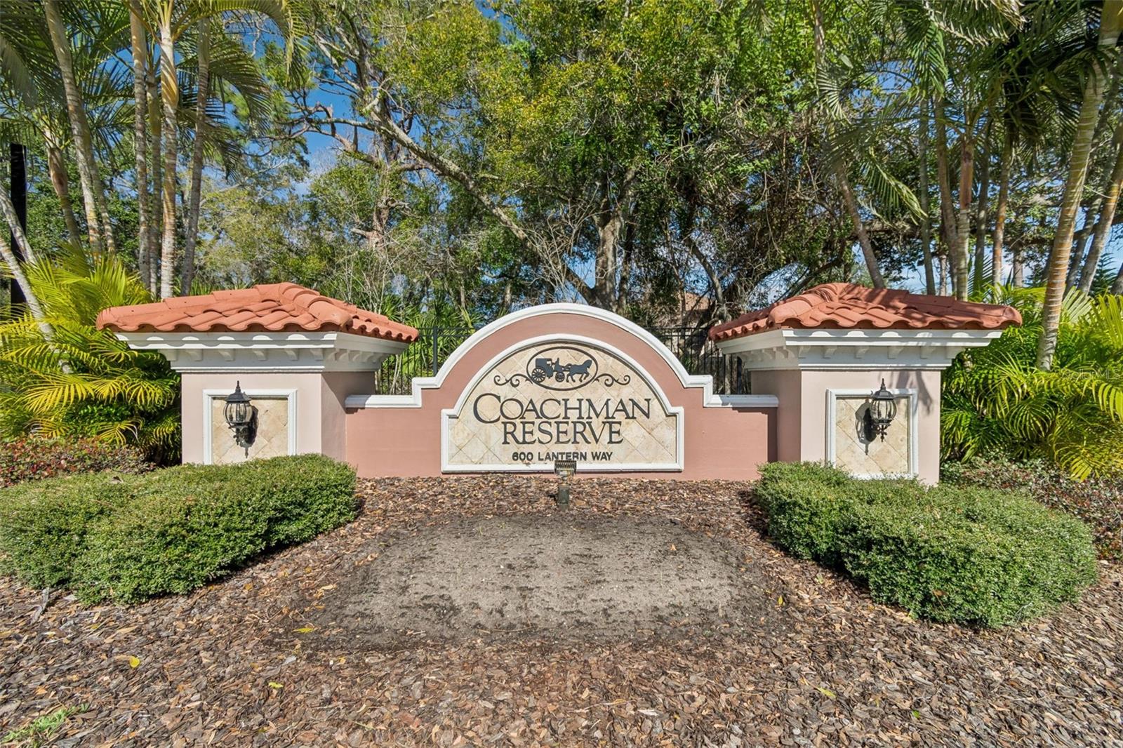 A beautifully manicured gated community offering serene surroundings, lush landscaping, and a warm sense of arrival.