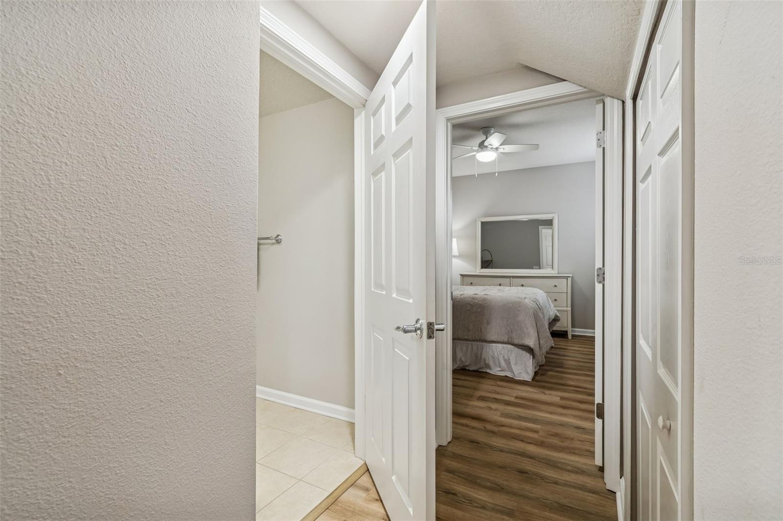 A secondary hallway offers access to the bedroom and bathroom, creating a practical and private layout.