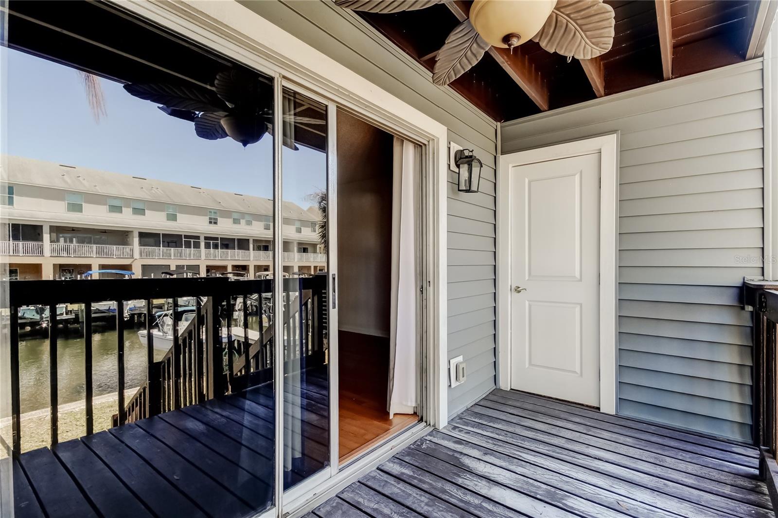 Covered Balcony with Storage Room off the Living Room