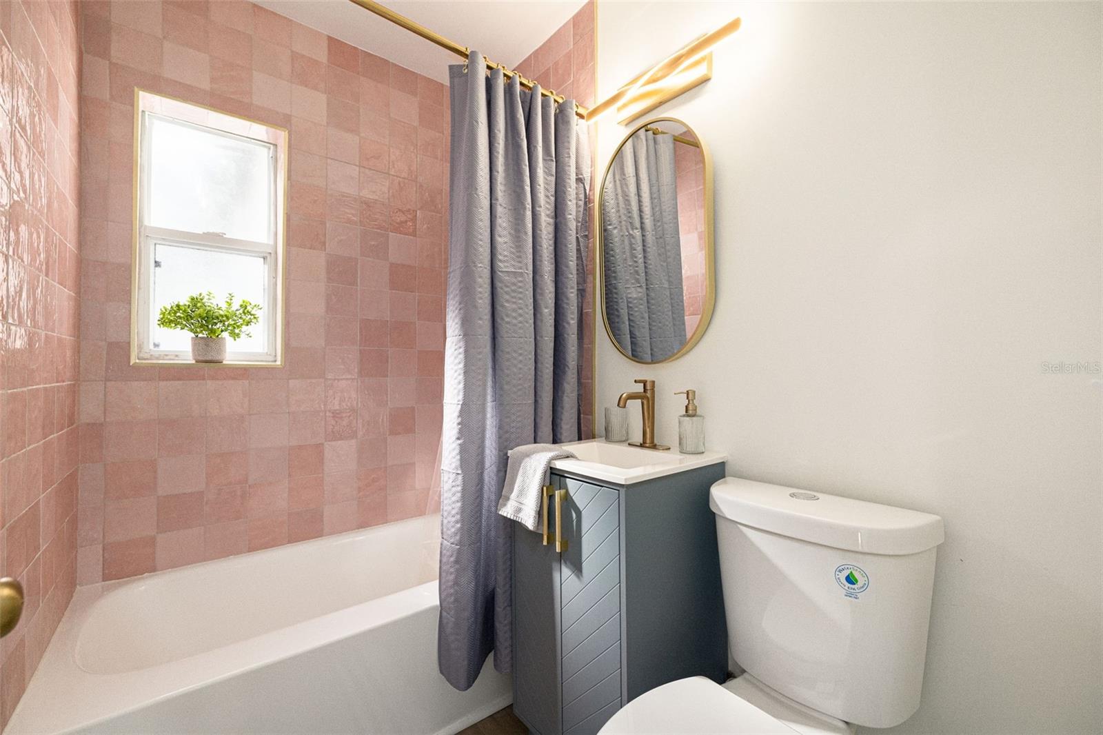 First bathroom keeping with the original bathroom colors.