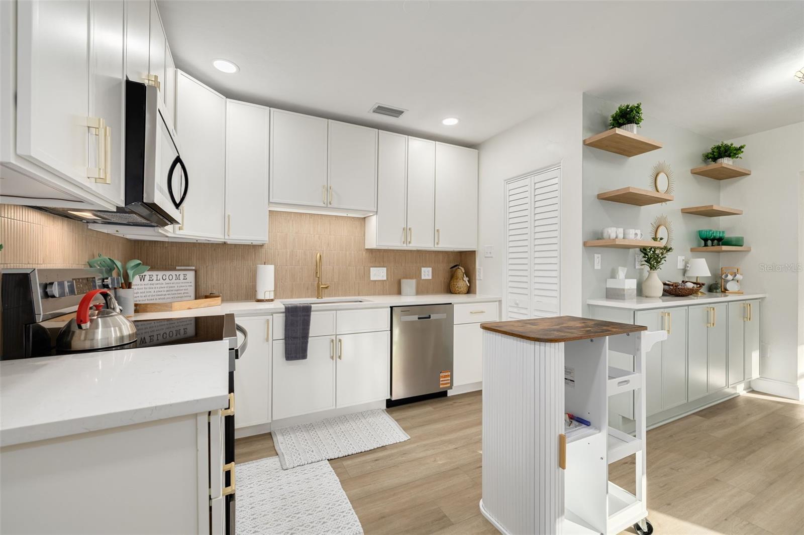 Kitchen with brand new appliances and a pantry.