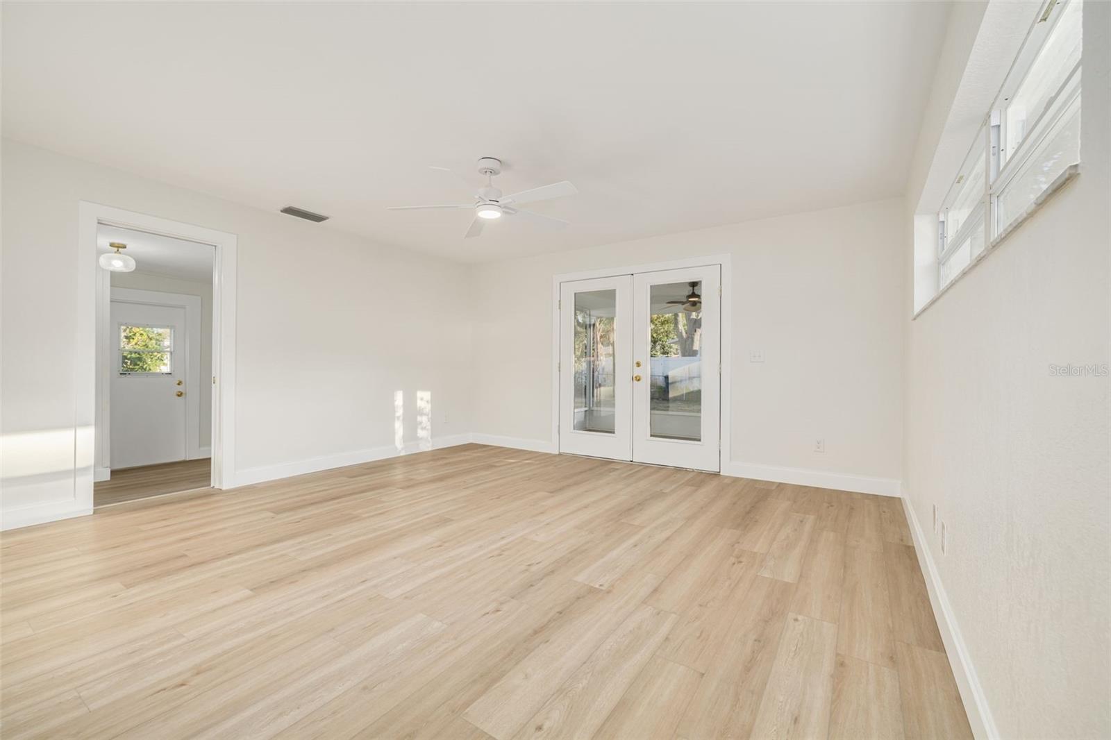 Family room with French doors going out to the screened in lanai.