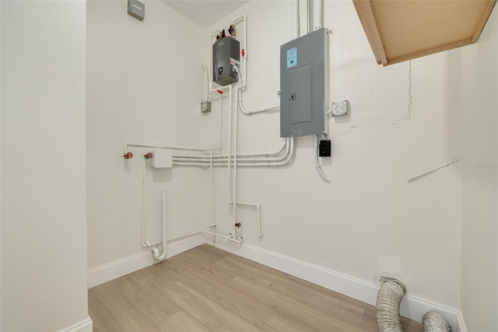 Laundry room with tankless water heater