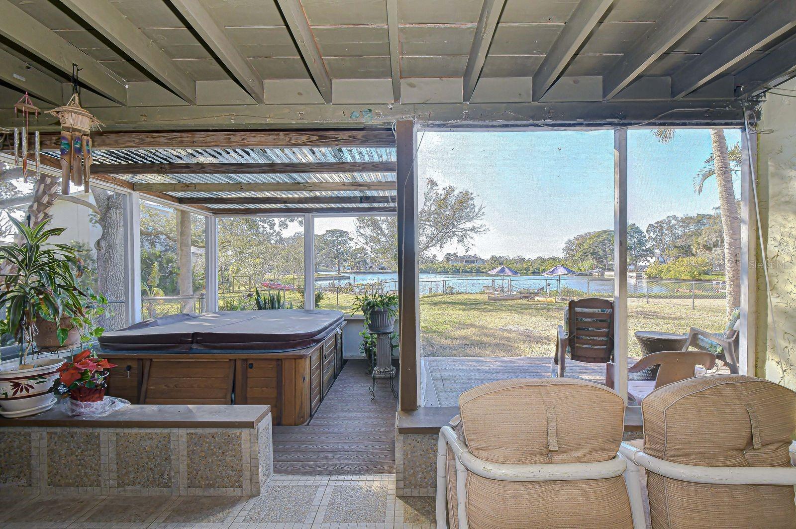 Morning coffee, evening wine...or both! The large screen room is calling you to relax for a while.