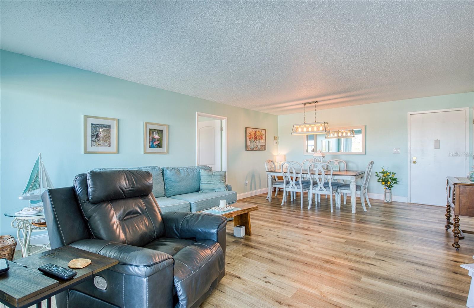 Living room/ Dining room combo featuring luxury vinyl