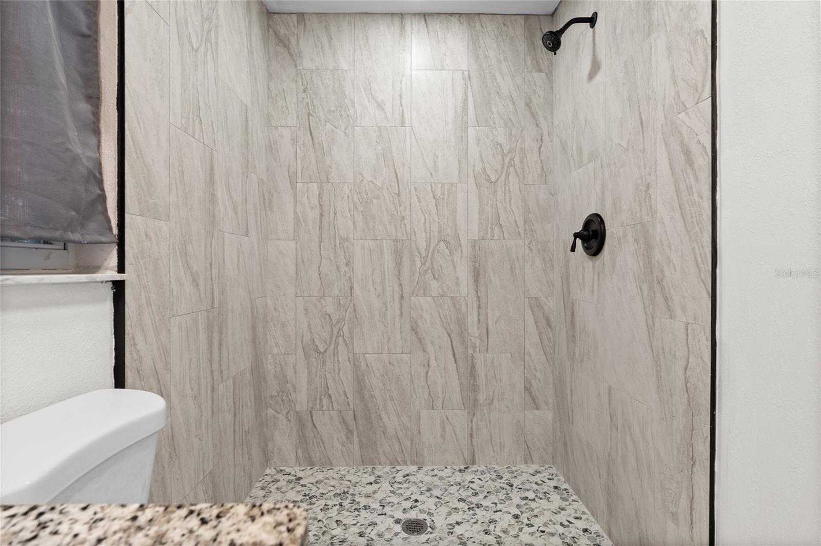 Primary Bath - Remodeled 2026 - New shower and tile floor