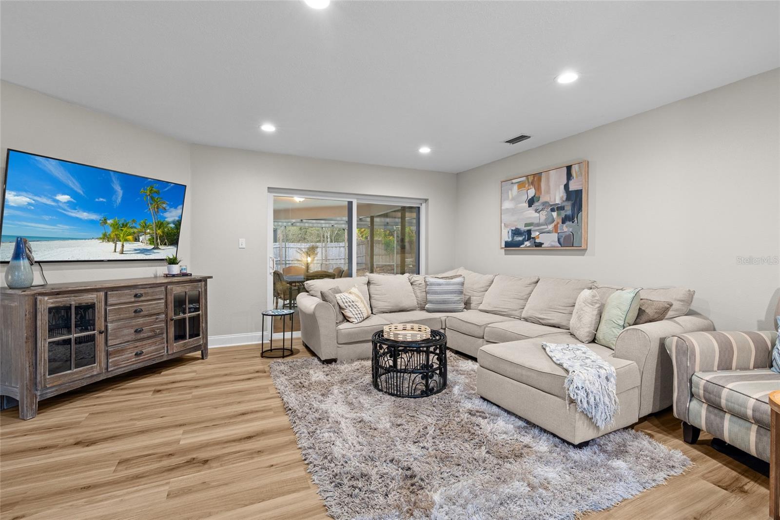 Living Room w/ view of pool & patio