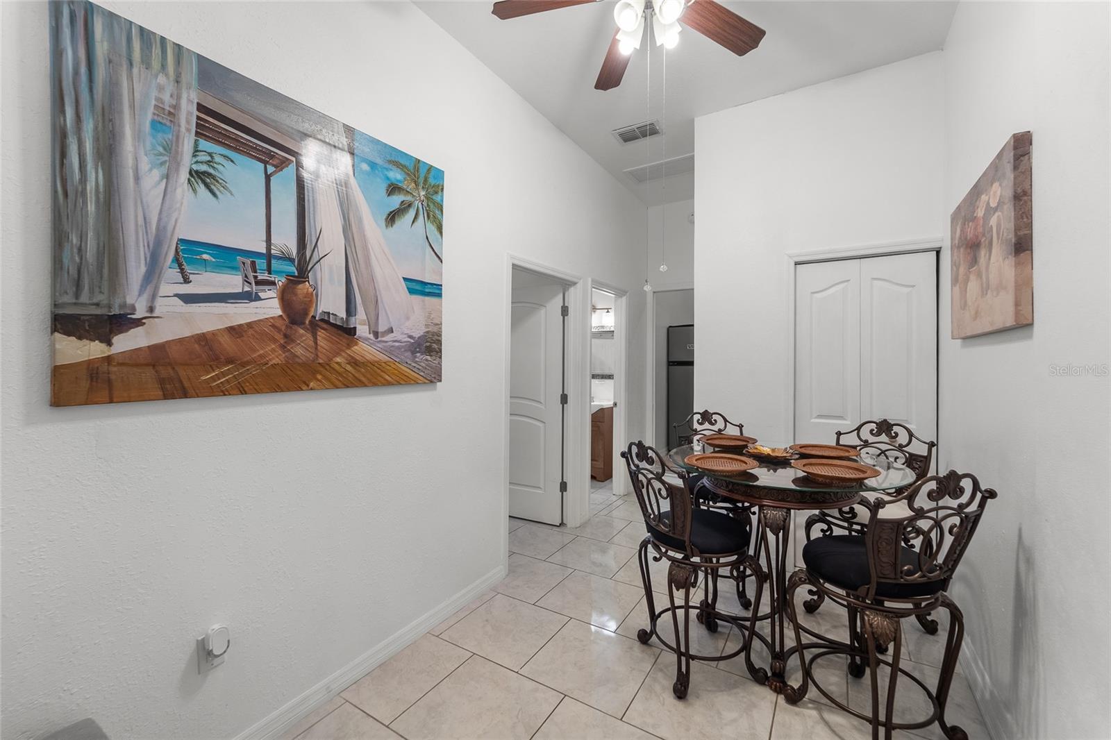 Entrance to the in law suite Living dining area combo with a closet.