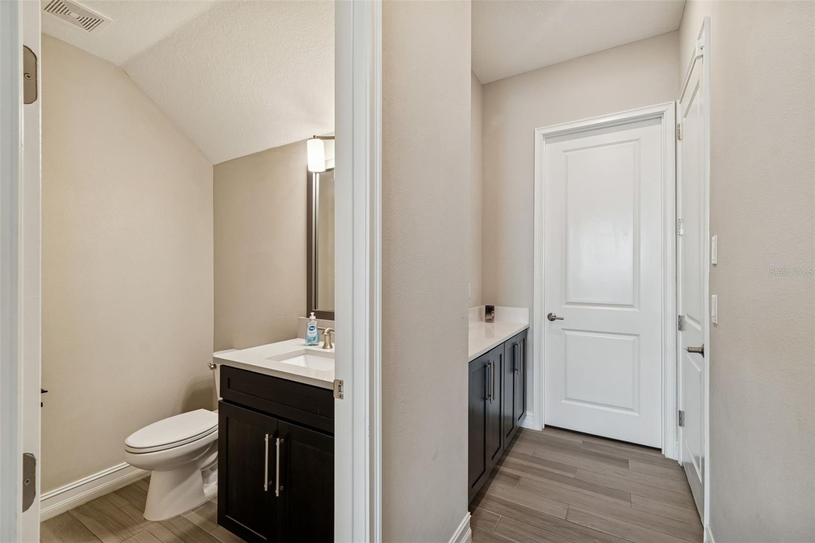 First floor half bath and hall to laundry