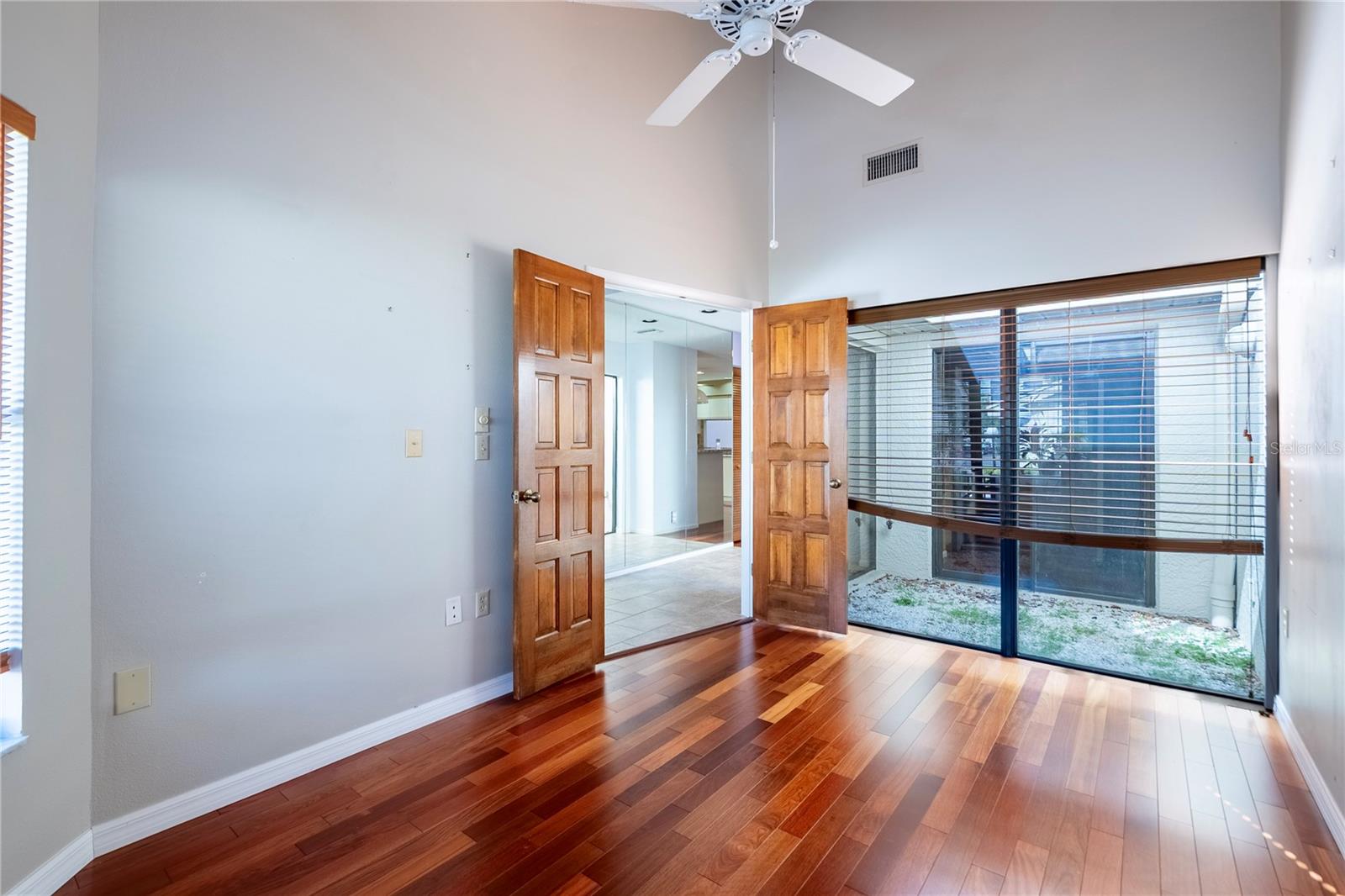 Den/flex room showing glassed atrium
