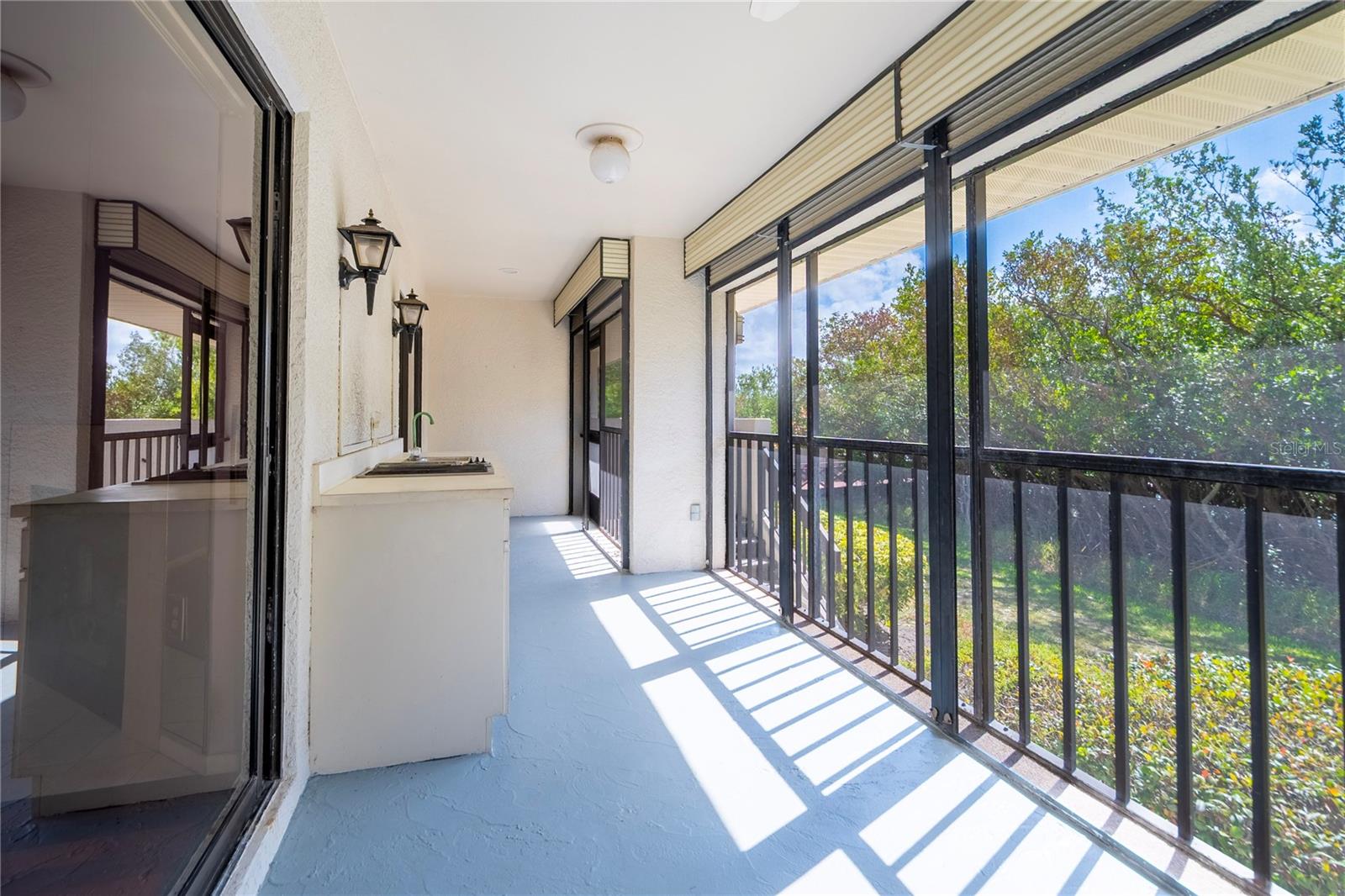 Lanai with outside entry door to boat slip
