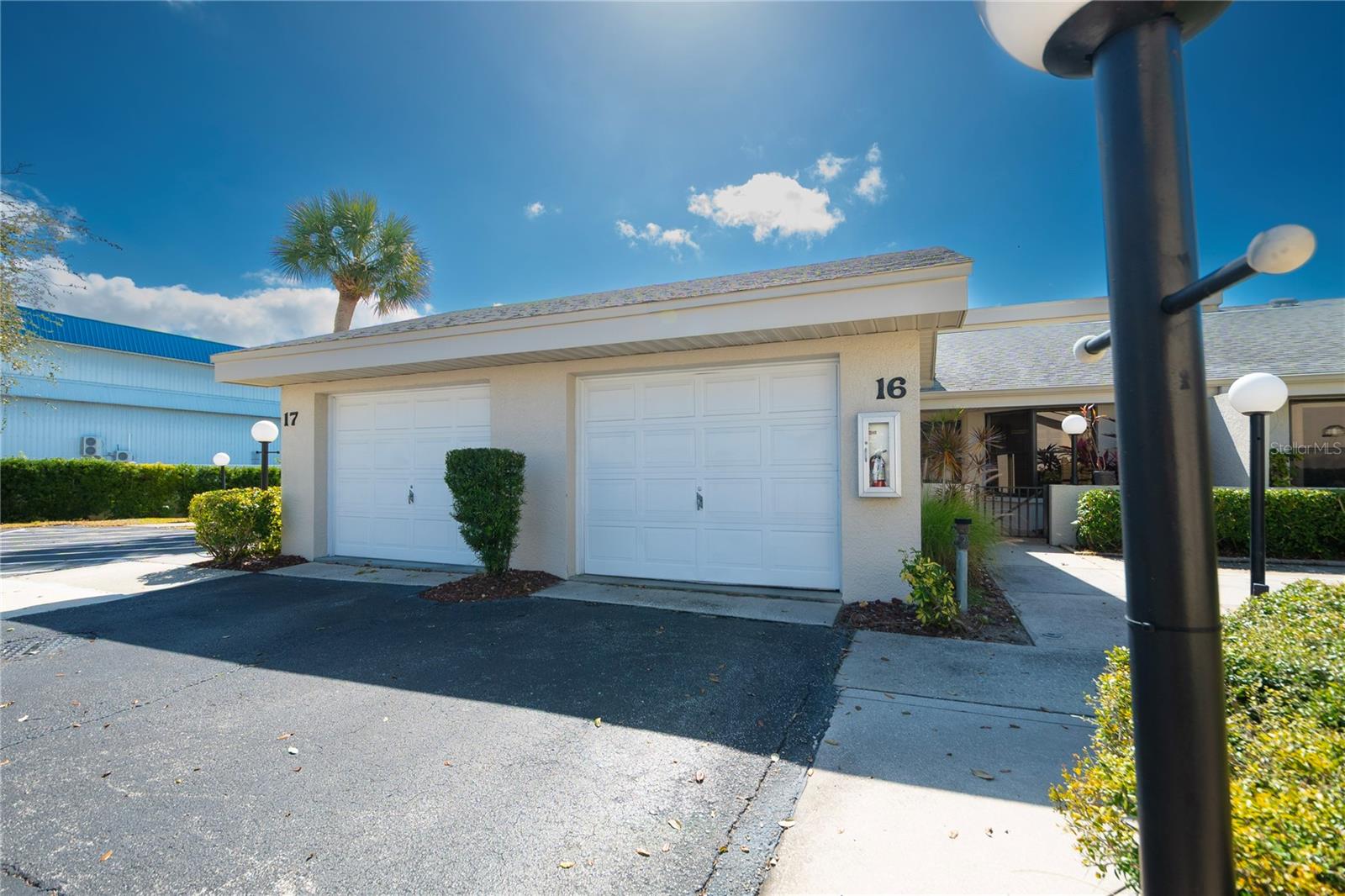 Entry walkway to the right of the garage