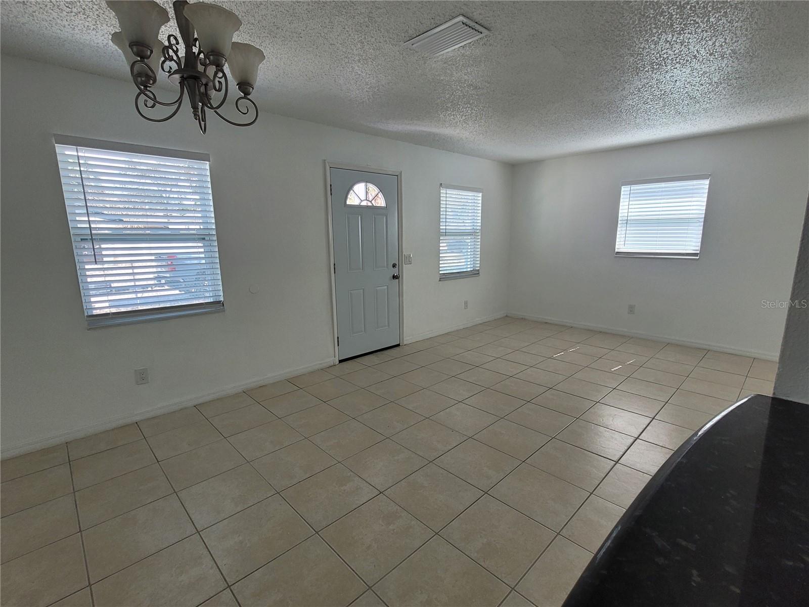 Kitchen view (bar) into family room
