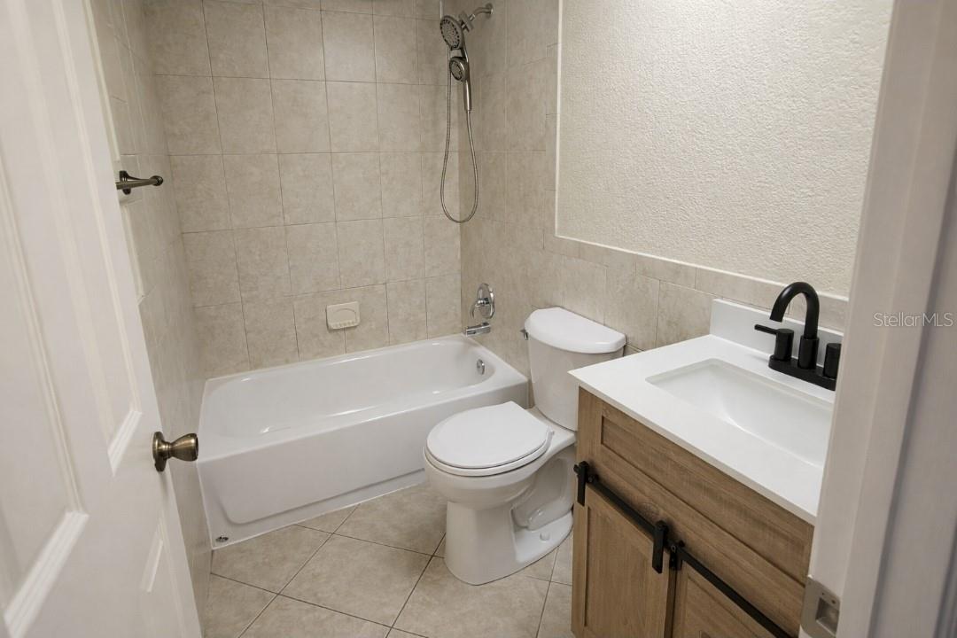Downstairs bathroom. New vanity/toilet/reglazed tub