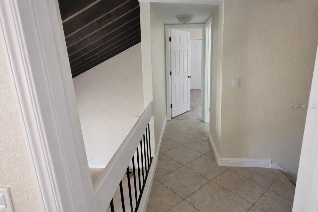 Landing looking at primary large bedroom bath to right