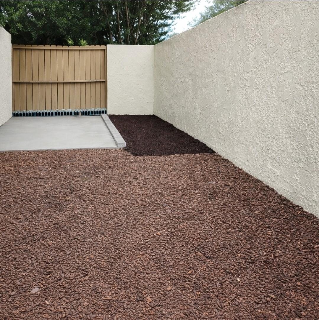 Patio outside kitchen w/privacy wall