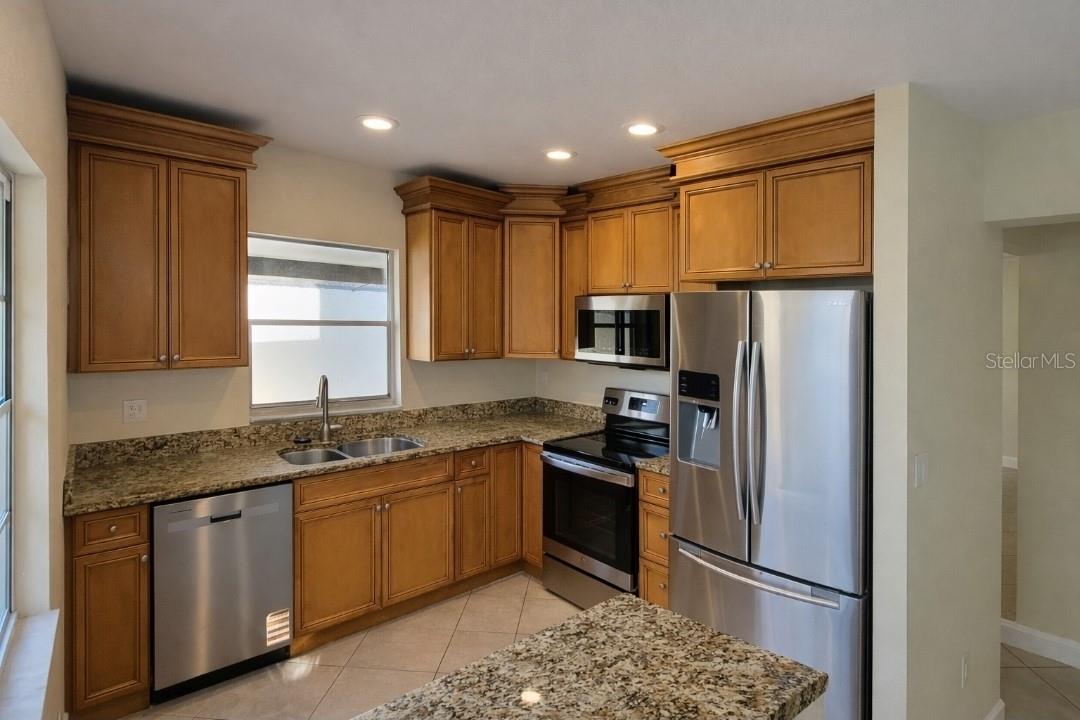 Kitchen island with storage. New dishwasher/stove/microwave/garbage disposal.