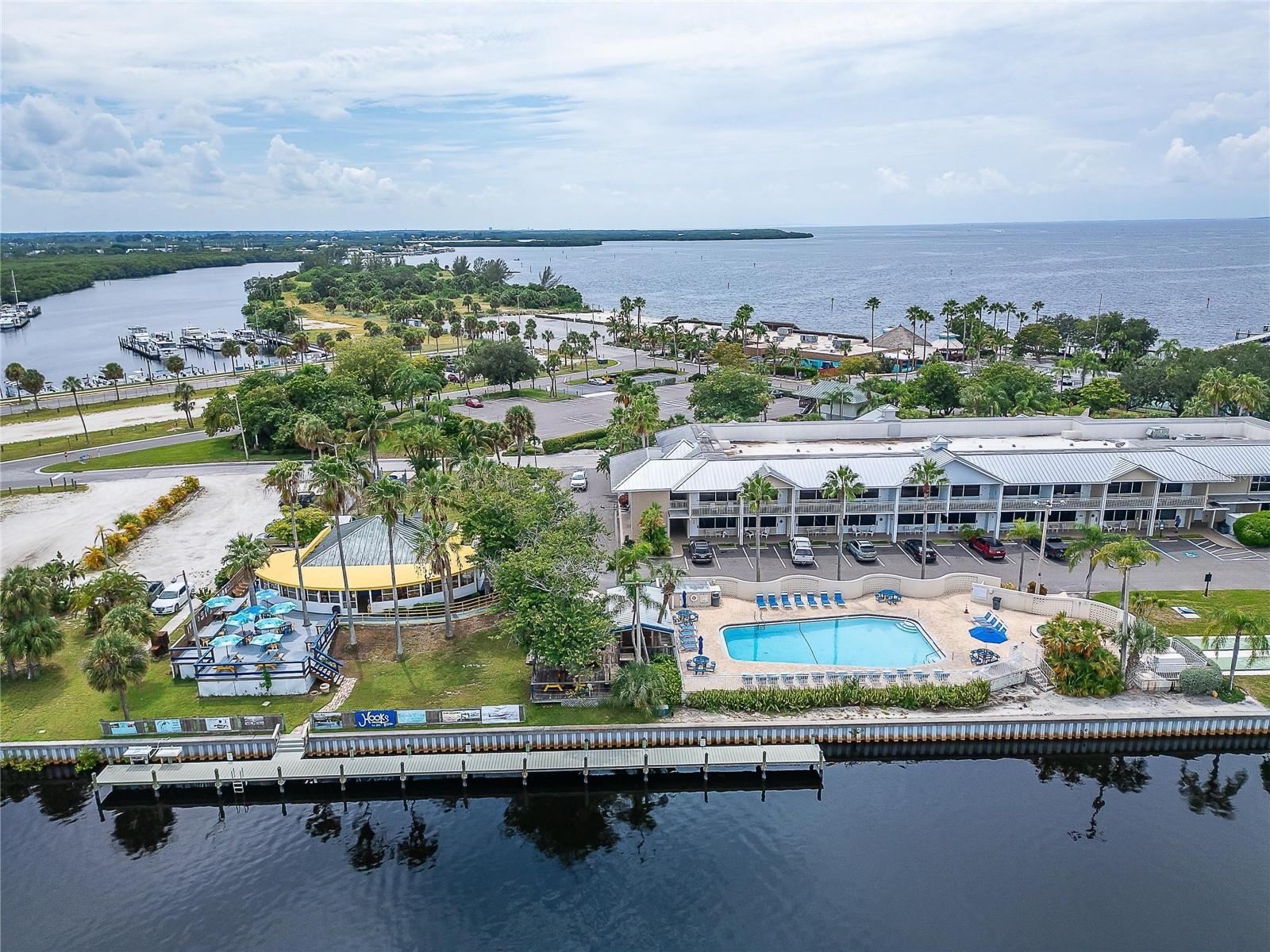 Aerial view of heated pool and hot tub and Hooks Waterfront Bar & Grill