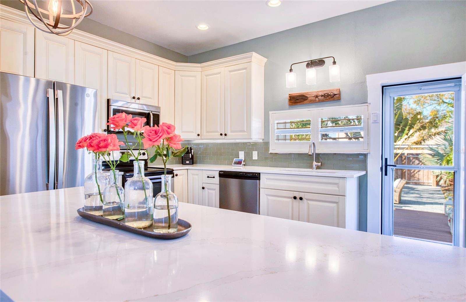 Enjoy a gorgeous quartz countertop island with bar seating- perfect for entertaining.